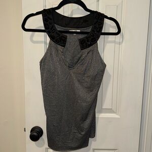 Sleeveless sparkler and black jeweled top